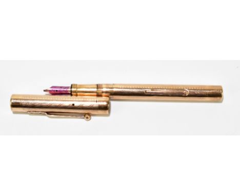 A 9ct yellow gold fountain pen with engine turned decoration, the nib signed 'Mabie Todd &amp; Co NY', stamped 9ct to the out