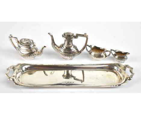 W A HUMPHRIES LTD; an Elizabeth II hallmarked silver miniature five piece tea set comprising tea and hot water pots, cream ju