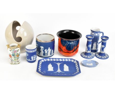 WEDGWOOD; a 19th century three piece blue jasperware dressing table set comprising a tray, a pair of candlesticks, together w