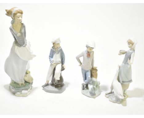 LLADRO; four figures comprising a large girl with basket of flowers, height 36cm, a girl feeding a goose, a boy with dog and 