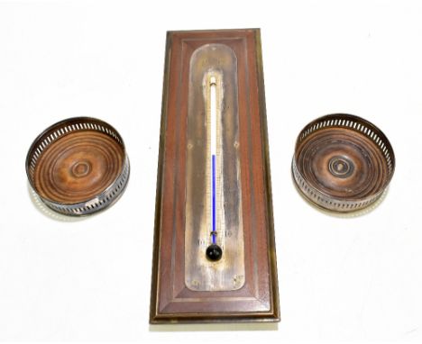 A late 19th century brass inlaid mahogany thermometer, height 37cm, together with two 19th century silver plated bottle coast