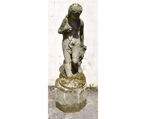 A reconstituted stone garden figure of a female bather on associated stand, height of figure 103cm, height of stand 37cm (2).