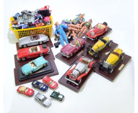An assortment of diecast toys including eight mounted onto faux rosewood plinths, various loose playworn Matchbox and other t