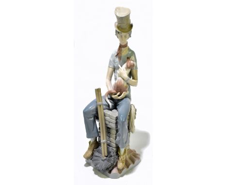 LLADRO; a large figure depicting a seated chimney sweep cradling a cat, height 46cm.Additional InformationGeneral wear throug