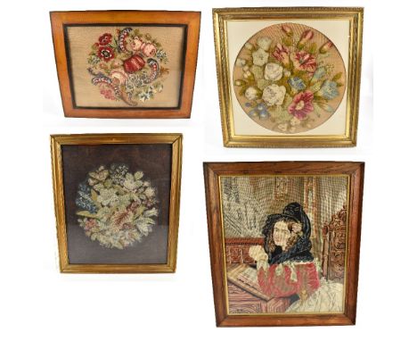 Three 19th century tapestry panels and a later example, three with floral decoration, largest diameter 53cm, each framed and 