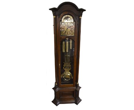 A reproduction oak cased longcase clock, the gilt metal dial with moon phase mechanism, above Roman and Arabic numerals, with