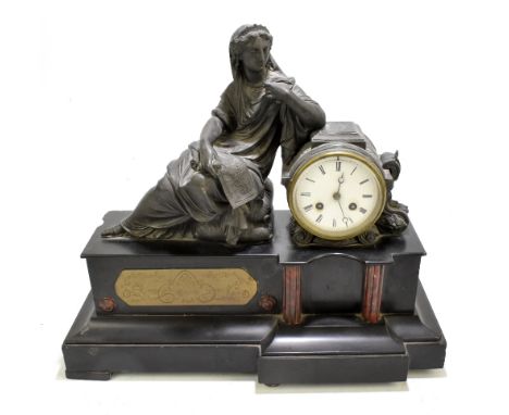 A late 19th century bronzed spelter and marble figural mantel clock modelled as a maiden seated beside a barrel, the dial set