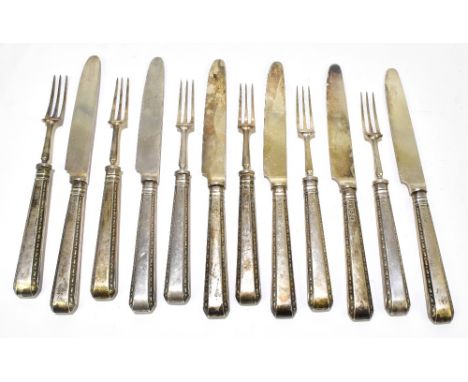 A set of six hallmarked silver handled fruit knives and forks, with plated blades, Sheffield 1923 (12).Additional Information