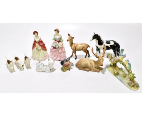 A mixed group of ceramic figures with Beswick including black and white horse, bullfinch and further, a Crown Staffordshire b