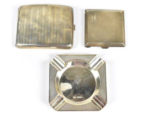 A hallmarked silver compact, with engine turned detailing and engraved 'DI, 1.8.53', Chester 1947, with a hallmarked silver c