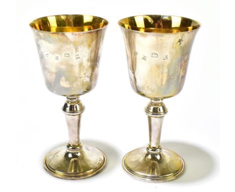 BROADWAY &amp; CO; a hallmarked silver pair of goblets, Birmingham 1974, 10.99ozt/341g, height 15.5 cm, both in fitted boxes 