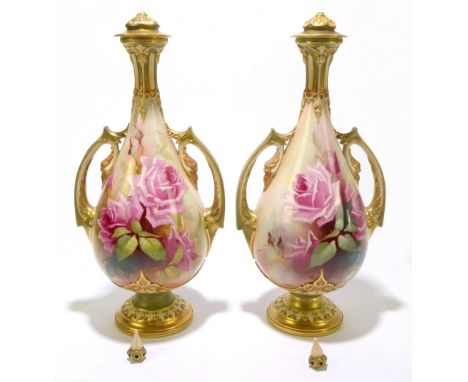 ROYAL WORCESTER; a pair of twin handled urn-form vases with gilt and hand painted rose blossom decoration, signed W.Jarman, g