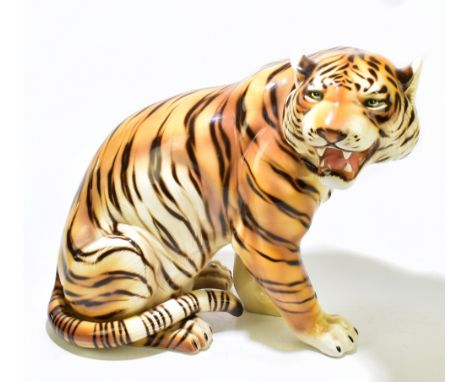 A 1970s Italian ceramic figure of a tiger, height 46cm, length 51cm.Additional InformationLight crazing, traces of emulsion p