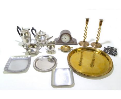 &nbsp;A hammered pewter mantel clock, 13.5 x 24cm, a round head hammered pewter tea set, two pewter dishes, a pair of brass b