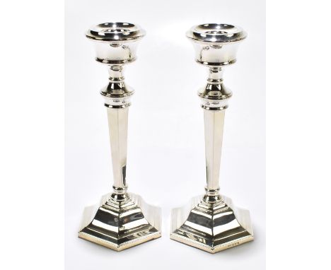 SANDERS &amp; MACKENZIE;&nbsp; a pair of Elizabeth II hallmarked silver candlesticks of tapered form on spreading hexagonal l