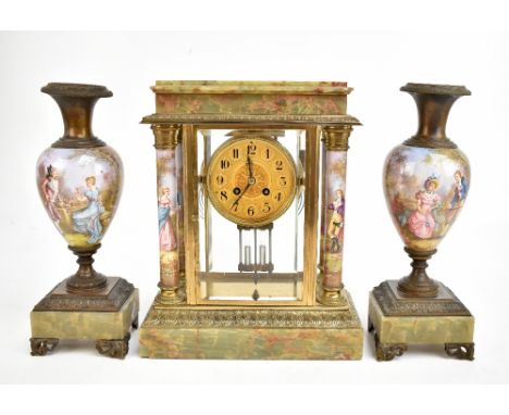 MARTI ET CIE; a late 19th century French onyx, gilt metal and porcelain mantel clock garniture, the eight day clock with gilt