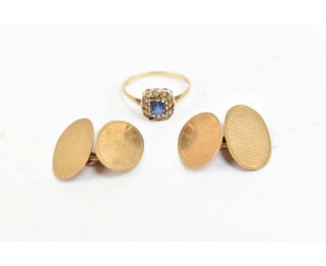 A 9ct yellow gold dress ring set with central princess cut blue stone surrounded by eleven white stones, approximate size N 1