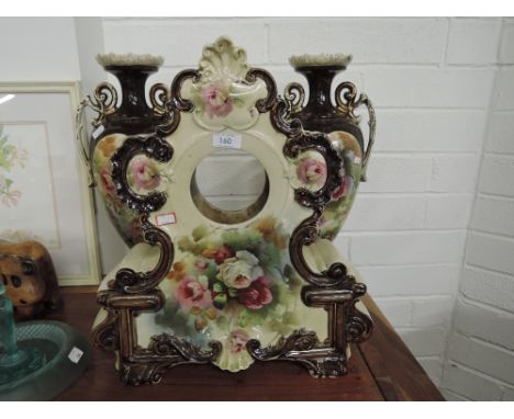 A vintage ceramic mantle clock body with vase decals in a very grand Regency design 