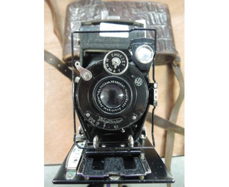 A Voigtlander folding camera with an Anastigmat lens and embezet shutter, in case