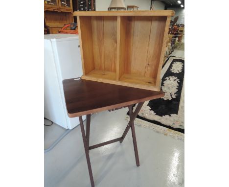 A small pine shelf and a folding table