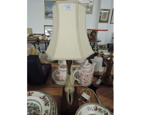 A table lamp in the form of a deers hoof