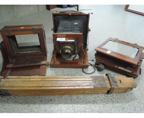 A mahogany sliding box camera with tripod by JB Dancer, optician Manchester A/F