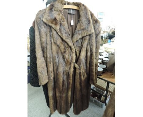 A mid brown fur coat, 