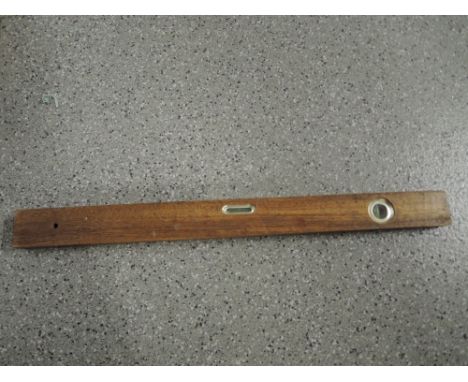 A vintage cabinet makers spirit level with treen body