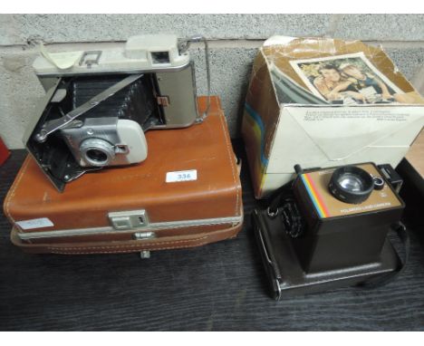 A Polaroid Land 80B folding camera in leather box with flash and a 1970's Polaroid Land Swinger II