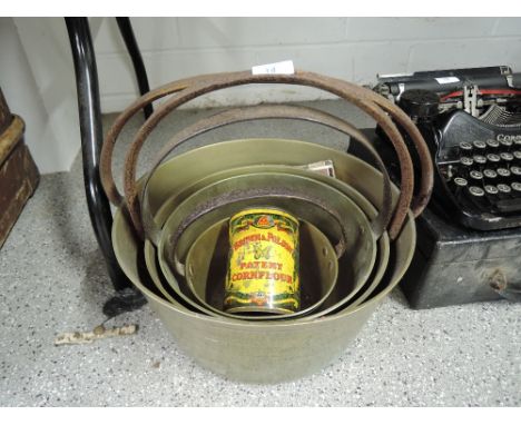 A selection of graduated vintage brass and cast handle jam pans also vintage advertising tin for Brown and Polson