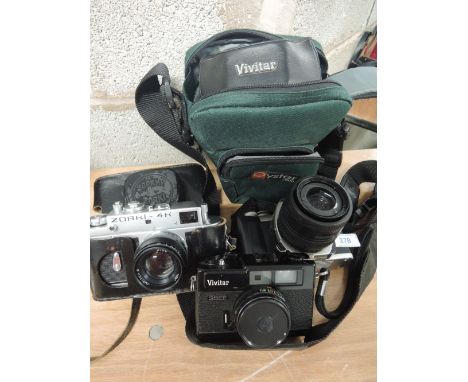 Three cameras including a Zorki 4K, a Vivitar 35EE and a Pentax MZ-X (in Oyster camera bag)