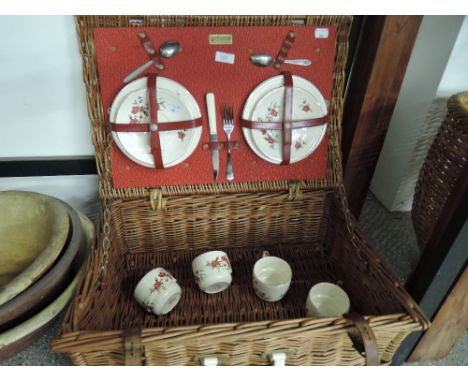 A vintage picnic set in woven wicker basket by Brexton 