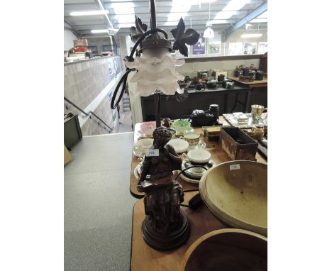A vintage figural lamp with smoked glass shade and classical maiden base