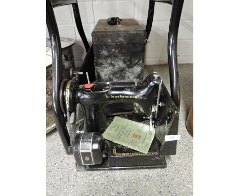 A vintage motor driven Singer sewing machine model no. 221K 