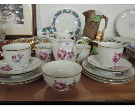 A vintage part tea service with floral print and gold trim