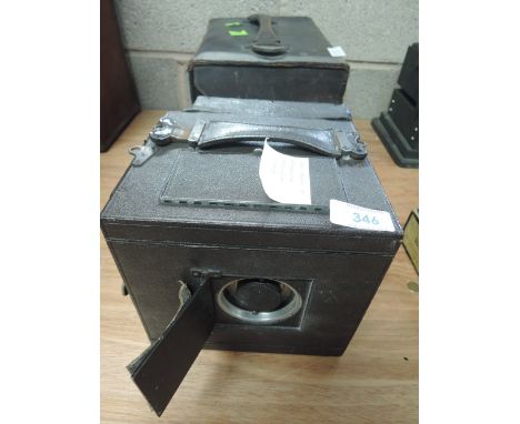 A 1903 Newman & Guardia Reflex camera, in original case with plates