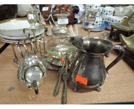 A selection of plated ware including candlestick, jugs etc