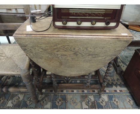 A mid 20th Century oak twist gate leg table