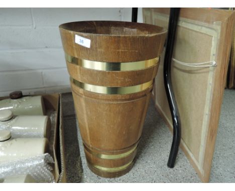 A treen oak body and brass ringed umbrella or stick stand 