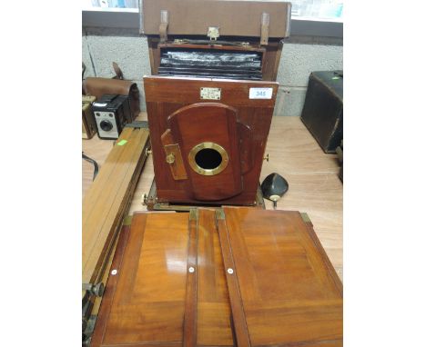 A Victorian J R Gotz No185 mahogany plate camera in original box with tripod and plates, no lens