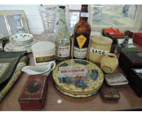 A selection of vintage advertising bottles tins and stone ware ceramics