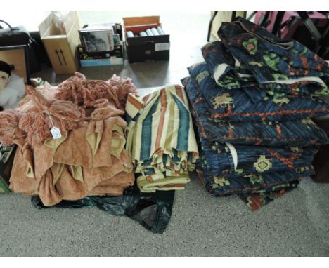 A selection of fabrics, curtains, cushions, pelmets and tie backs