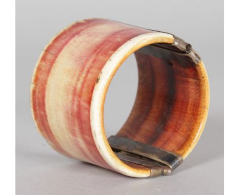 A BONE SLAVE BANGLE.
