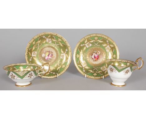 TWO CUPS AND SAUCERS, painted with flowers. Pattern No. 6148, Col No. 003.