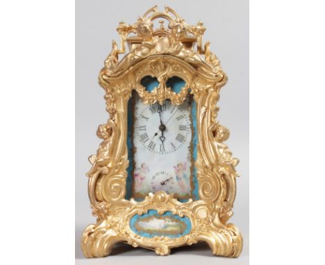 A FRENCH ORMOLU AND SEVRES MANTLE CLOCK with alarm, and painted Sevres style porcelain panels. 9ins high.