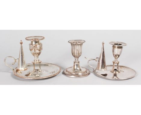 TWO GEORGE III CIRCULAR CHAMBER CANDLESTICKS and a single circular candlestick.