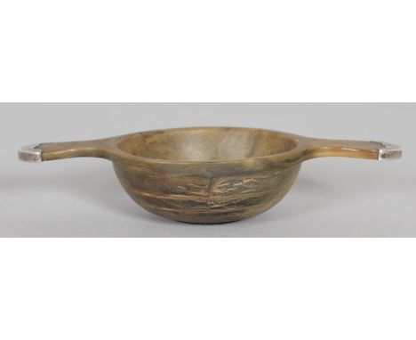 A SMALL SILVER MOUNTED RHINO HORN TWO HANDLED QUAICH. Chester hallmark 1904.  Maker: Haseler Bros.  Bowl 2.75ins diameter.