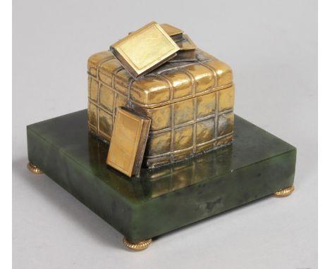 A RARE "FABERGE" JADE AND SILVER INKWELL, as a box with lid and four books, standing on a green jade base. 4ins.