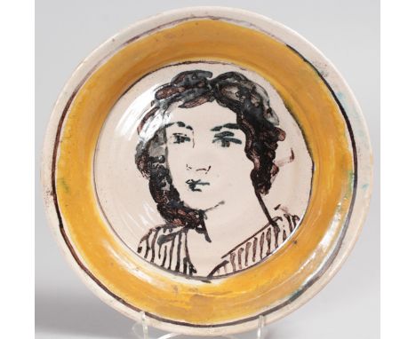 QUENTIN BELL POTTERY, FULHAM (1910-1996) A CIRCULAR SHALLOW BOWL, portrait head and shoulders of a young girl.  Signed.