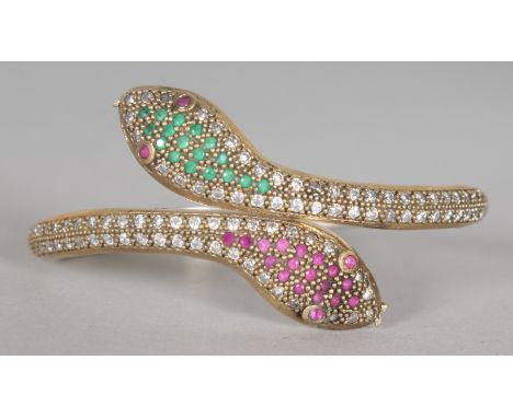 A SNAKE BRACELET with ruby eyes, set in silver gilt.